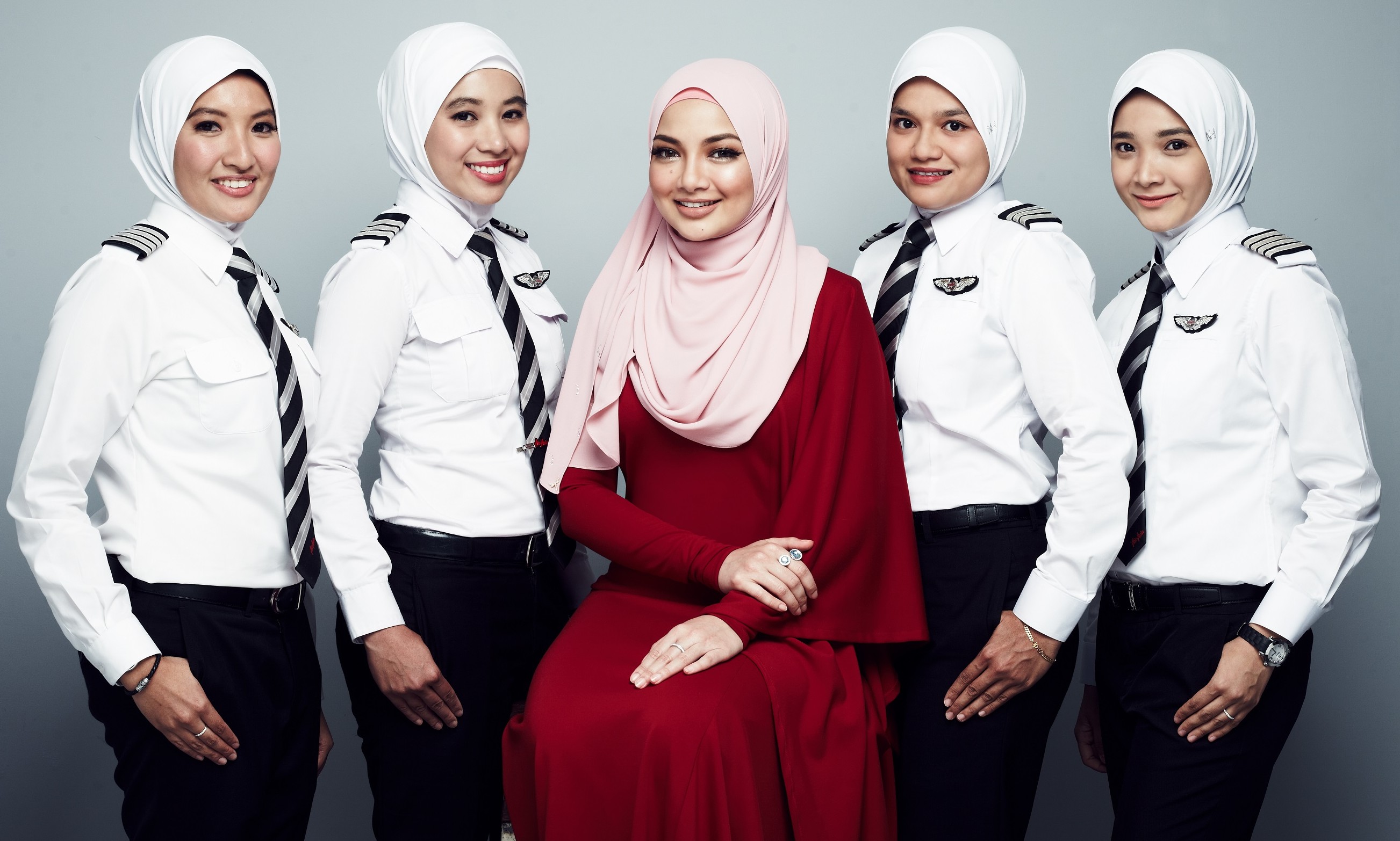 AirAsia partners hijab brand from Malaysian famous hijab icon, Neelofa (in red) to create exclusive headscarf for female pilots | Marketing Interactive